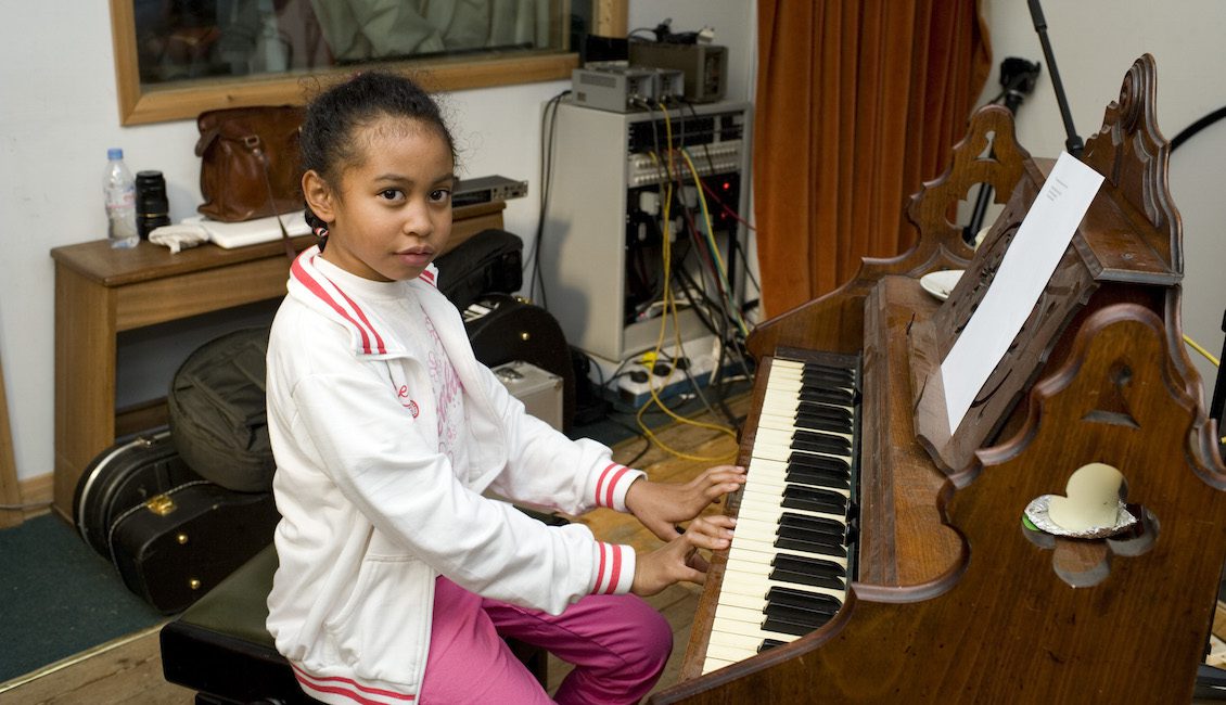 Girl at piano in recording studio - Communion Records (photo: Miriam Douglas)