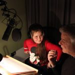 Writing Mentor and child recording an audio story