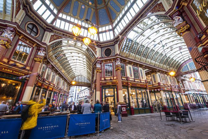 Leadenhall Market is a vast space with tall, glass ceilings and ornate, gold brass work details