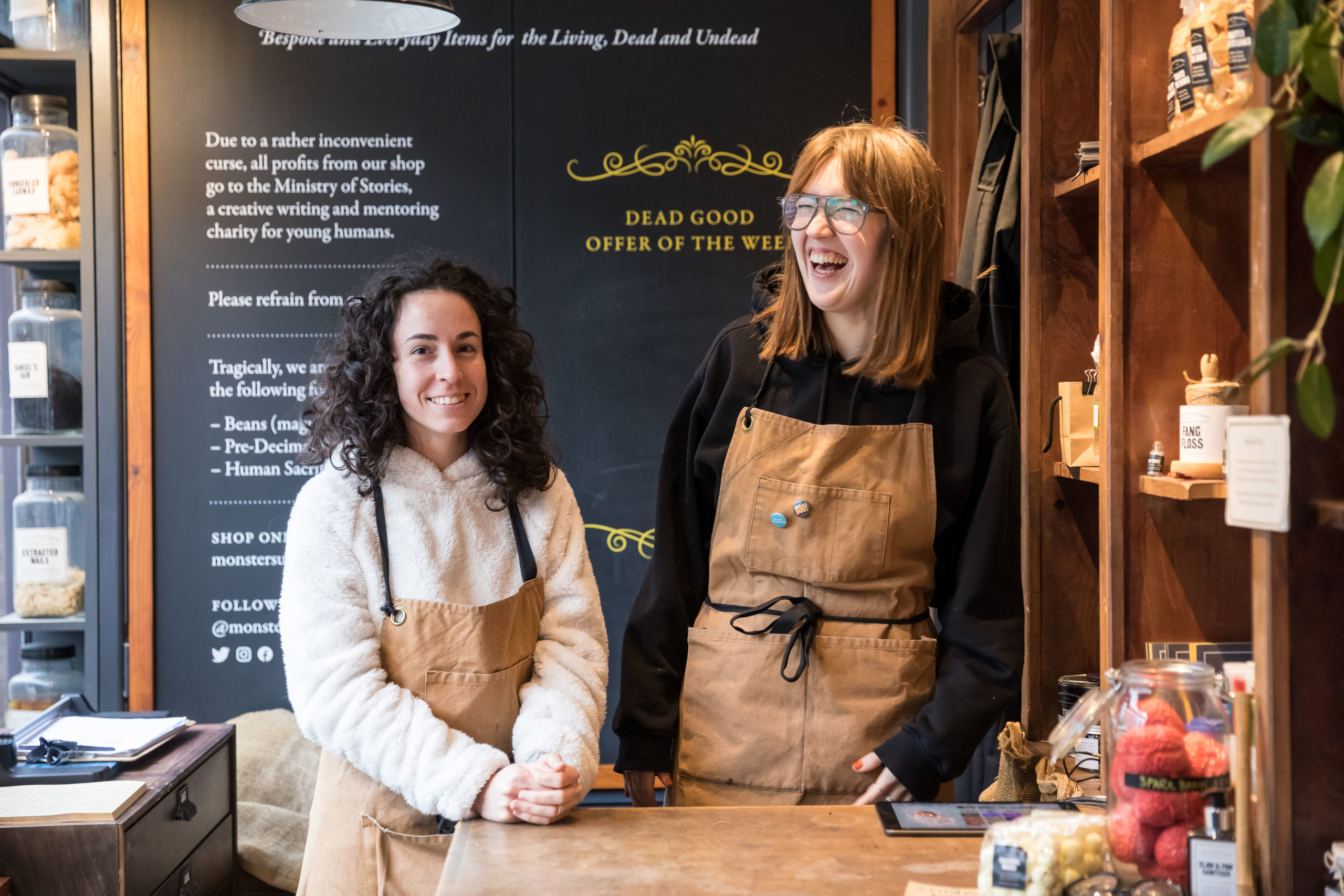 two female shopkeepers laugh with each other at Hoxton Street Monster Supplies