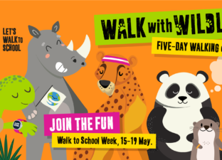 A group of illustrated animals hold a banner saying walk for wildlife