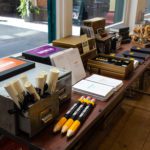 Scrolls and giant sized pencils mingle together next to monster writing packs in the store window
