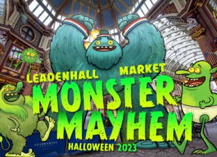 A photo of Leadenhall Market, with large cartoon monsters placed inside and featuring the words Monster Mayhem.
