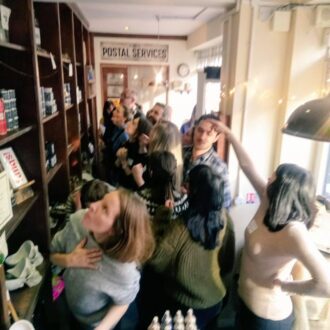 Image shows a team of people taking part in a scavenger hunt in our shop for monsters